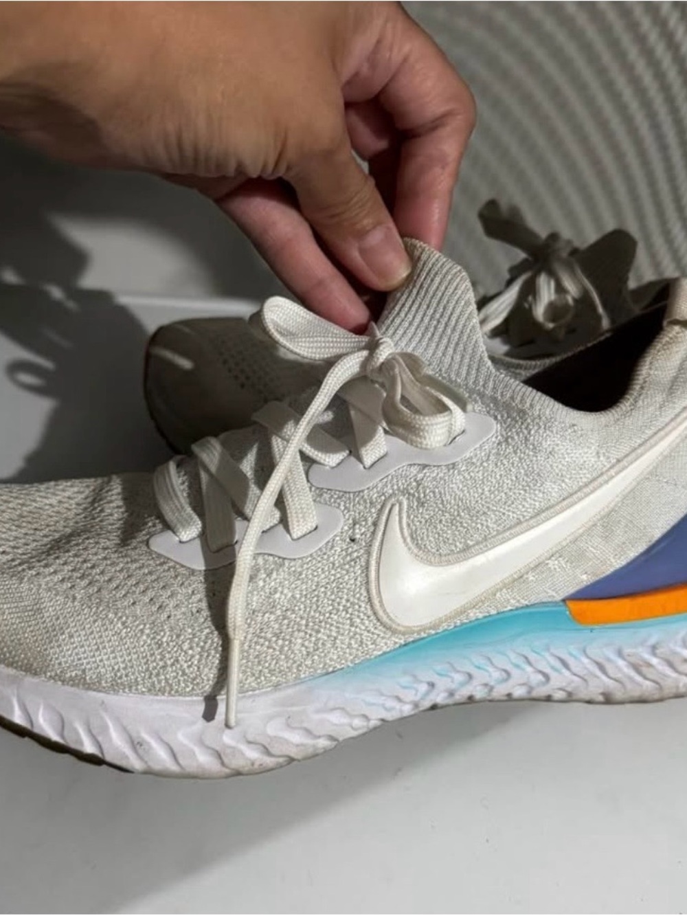 Nike Women’s Cream Knit Running Sneakers with Blue and Orange Accents
